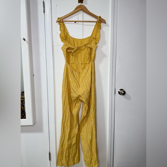 Yellow pinstripe tie back jumpsuit with front ruffle & adjustable straps. Size M - Picture 4 of 8